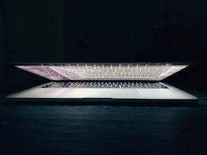 Open laptop displaying a step-by-step coding tutorial interface