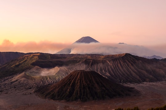 silhouette photo volcanoes during golden hour in Bromo Tengger Semeru National Park Indonesia