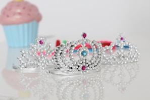 silver-colored tiara rings with clear gemstones