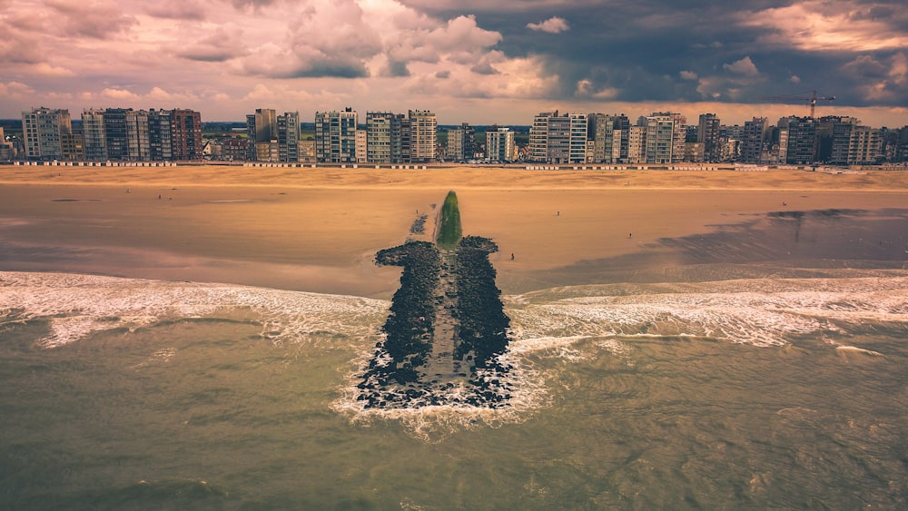 city buildings across beach shore