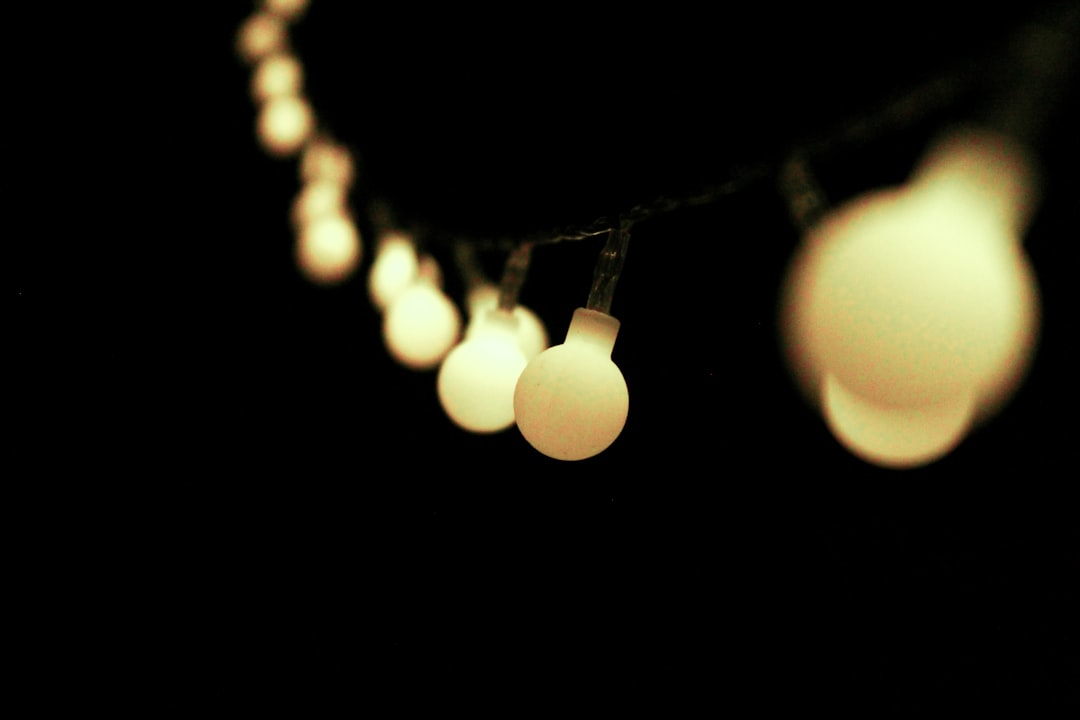 selective focus photography of yellow string lights