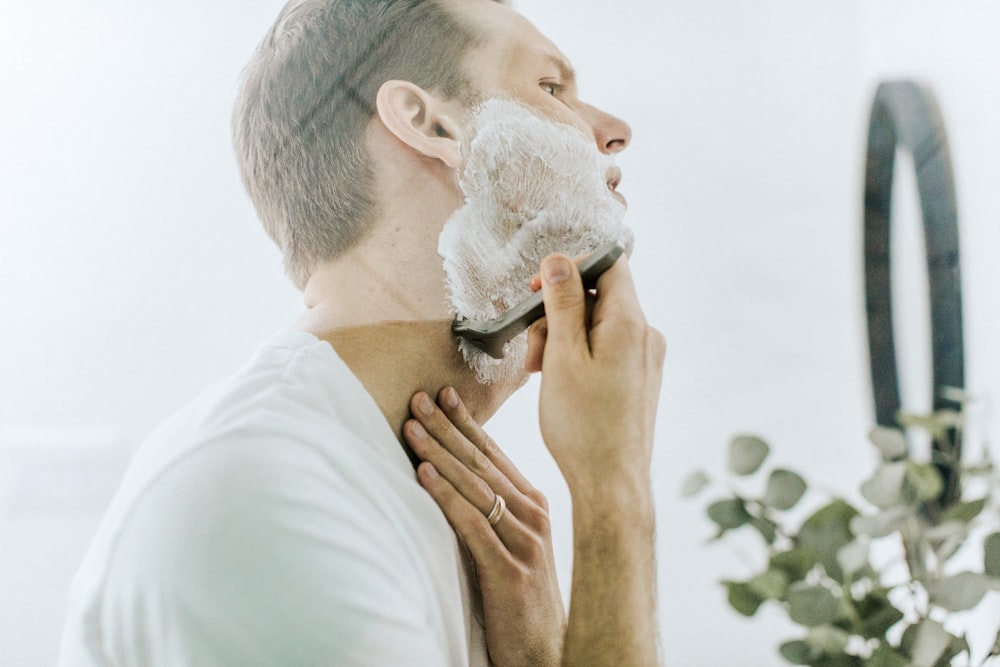 Man shaving his face