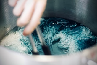 person cooking pasta