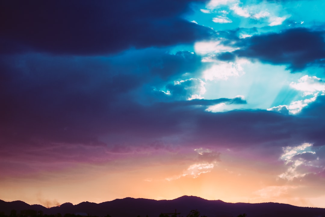 mountains and clouds during sunset