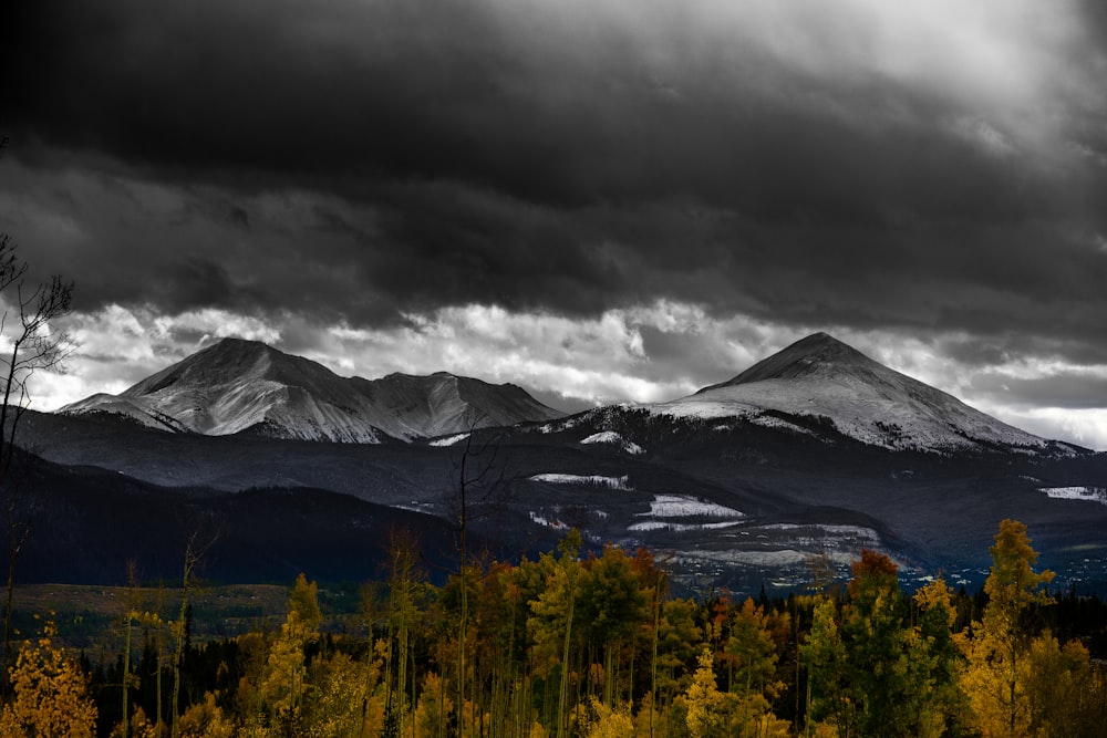 landscape photography of mountains under cloudy sky