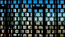 Abstract network grid overlaying a city skyline symbolizing integrated technology systems.