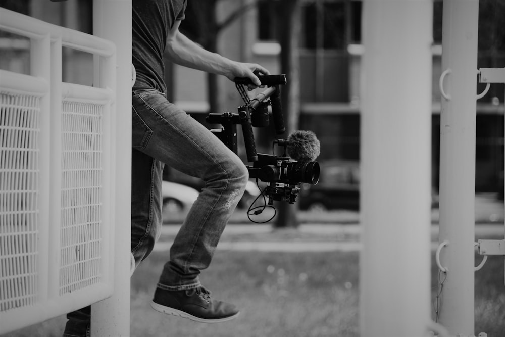 person holding video recorder during daytime