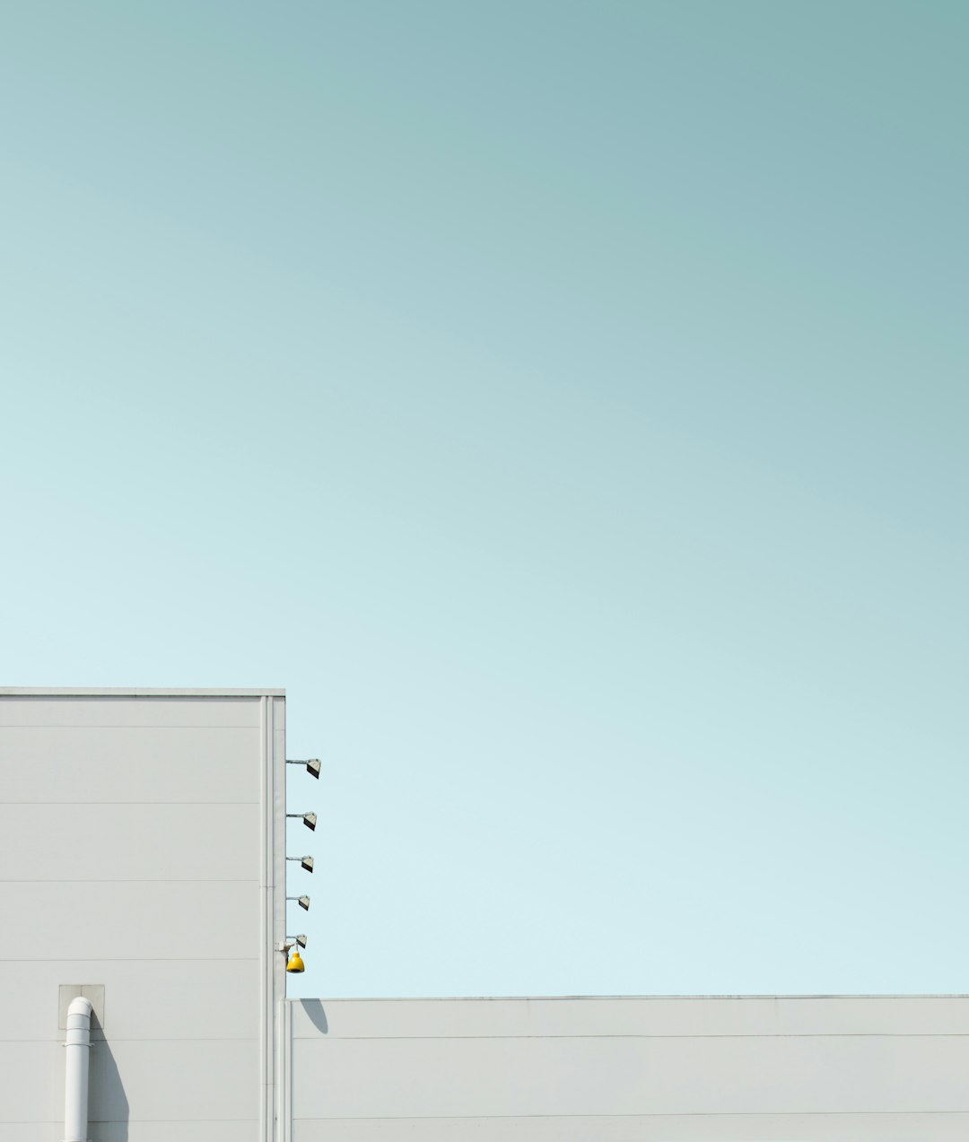 white concrete building under blue sky