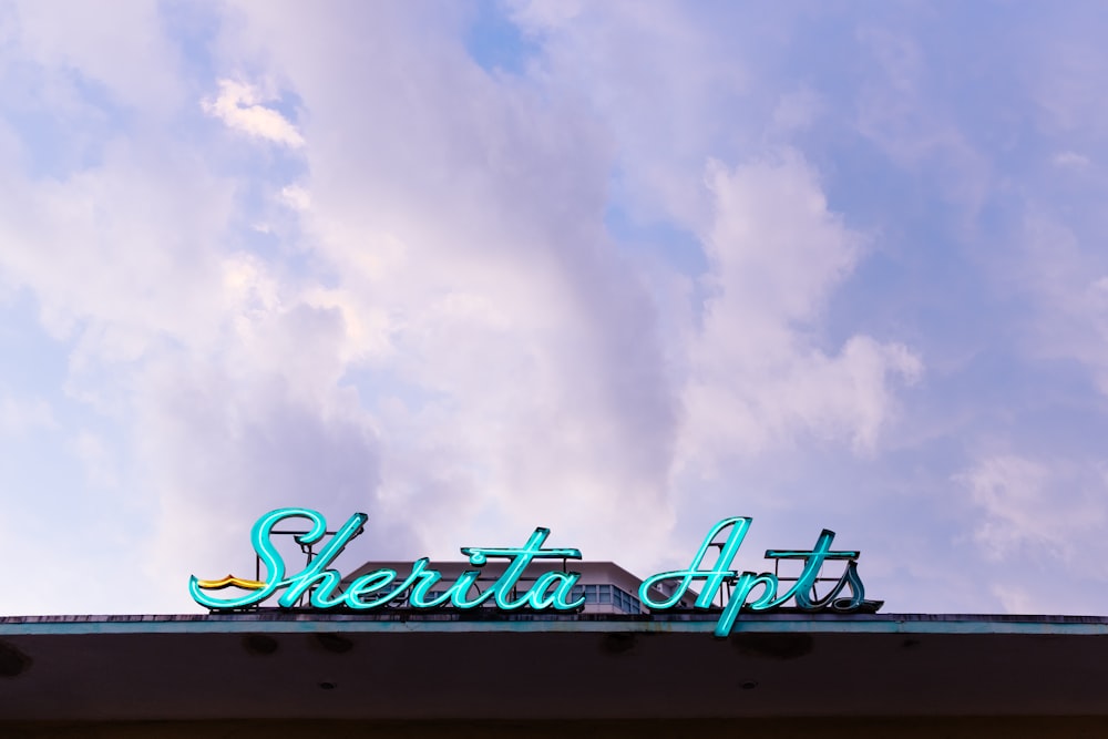 Sherita Apts lighted signage on structure