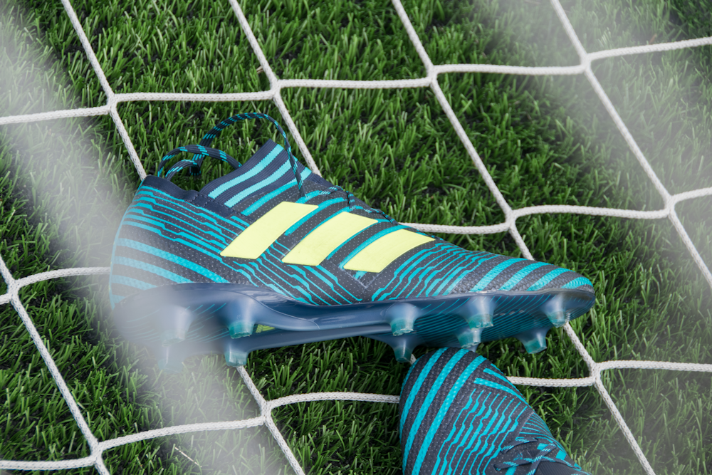 Black adidas cleats lean on white and black adidas soccer ball on green  grass photo – Free Line Image on Unsplash