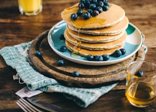 blue and white ceramic plate with pancakes