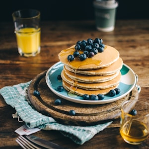 blue and white ceramic plate with pancakes