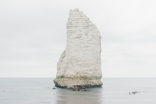 white stone formation in the middle of the sea in Location gite Etretat /maison de vacances France