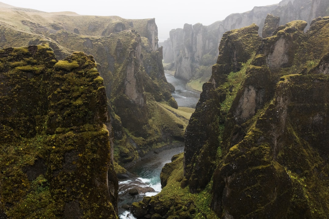 landscape photography of river between rocky mountains