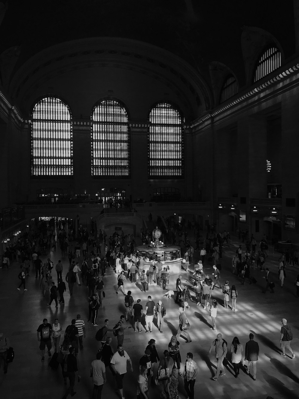 grayscale photography of people inside building