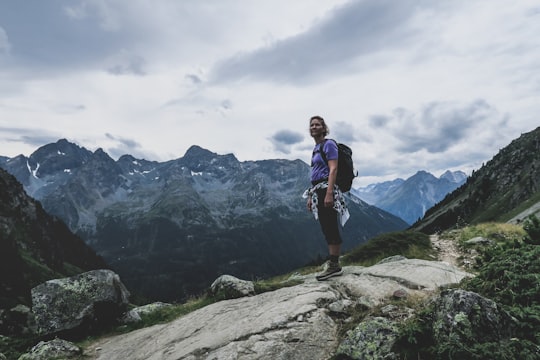 man on cliff mountain in Winnebachseehütte Austria