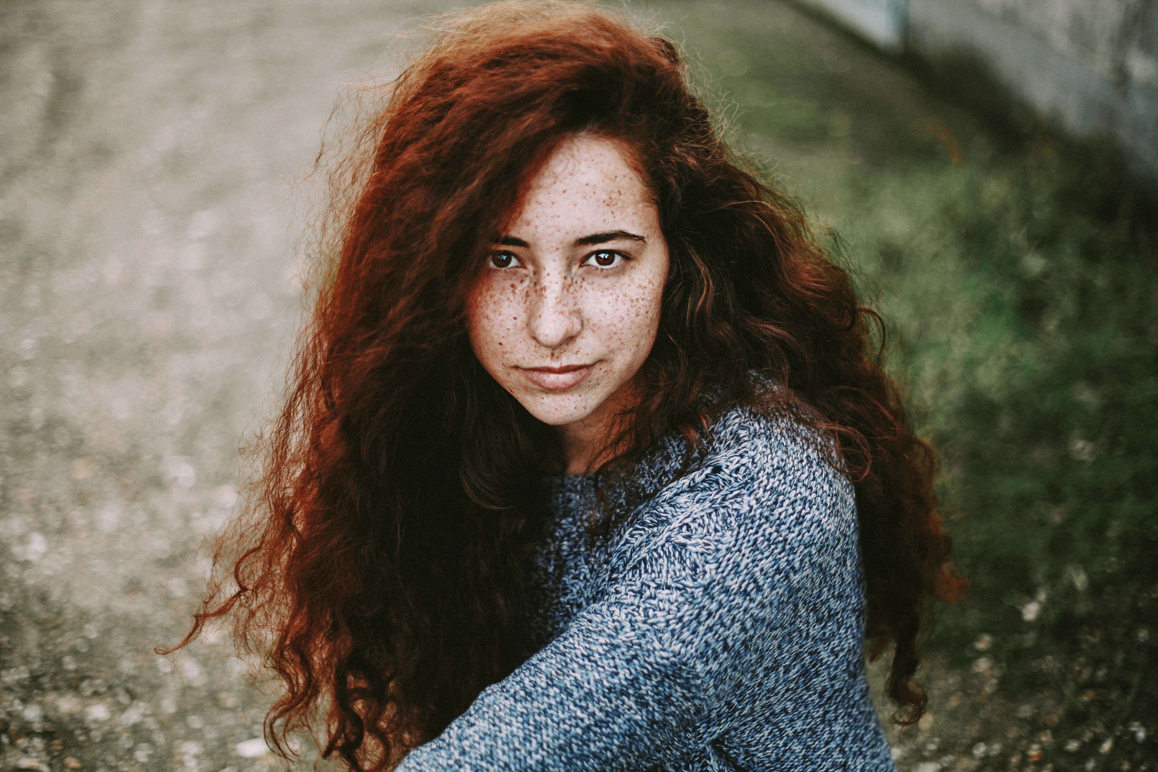Woman with long red hair in soft natural light