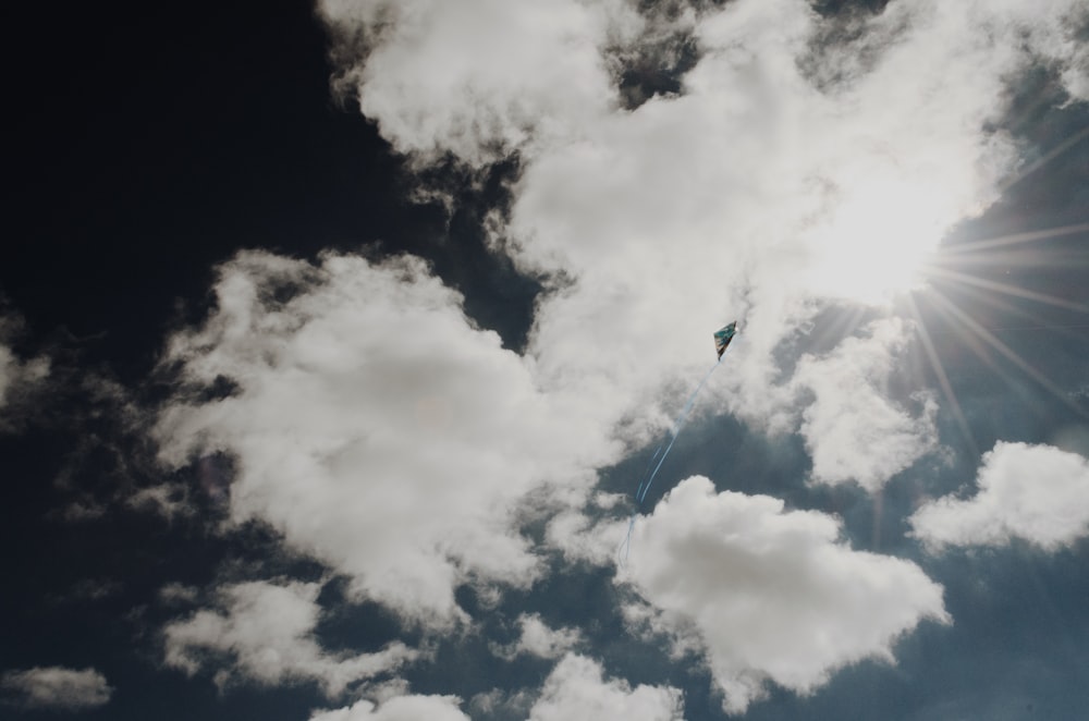 low angle photo of white clouds under sun