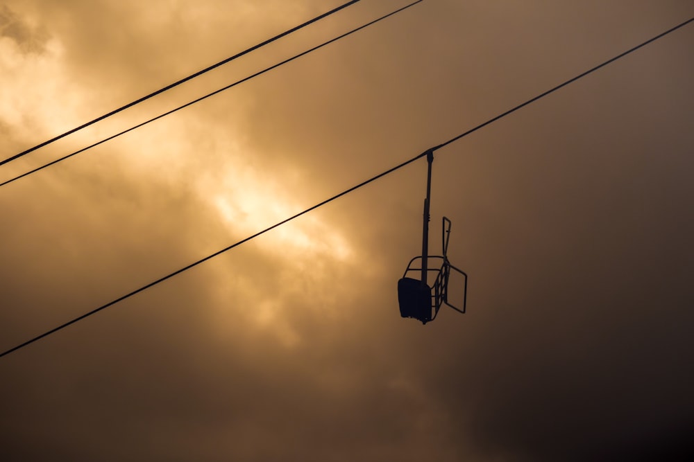 black cable car under cloudy sky during daytime