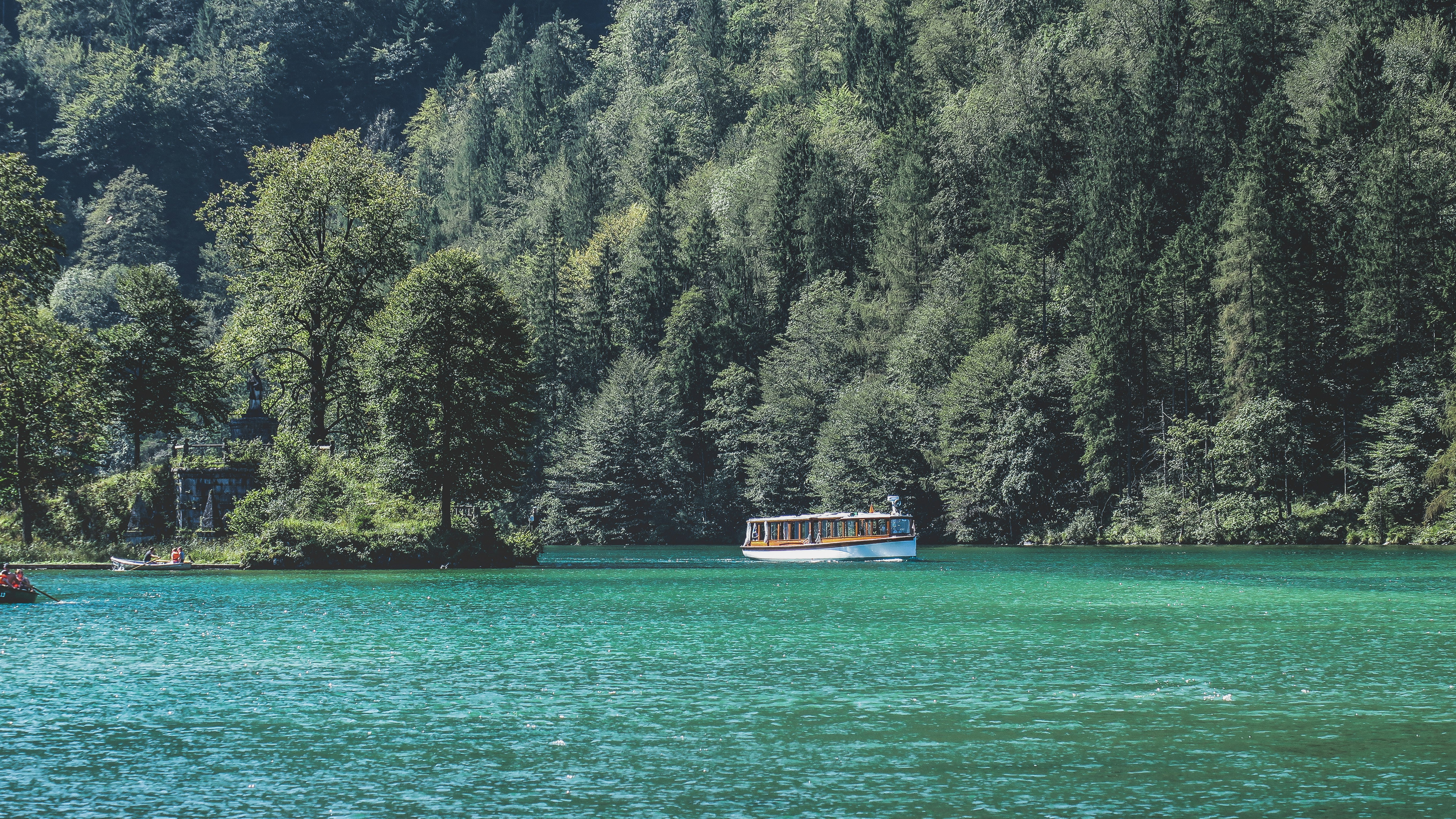 white boat on body of water