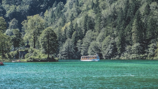white boat on body of water in Königssee Germany