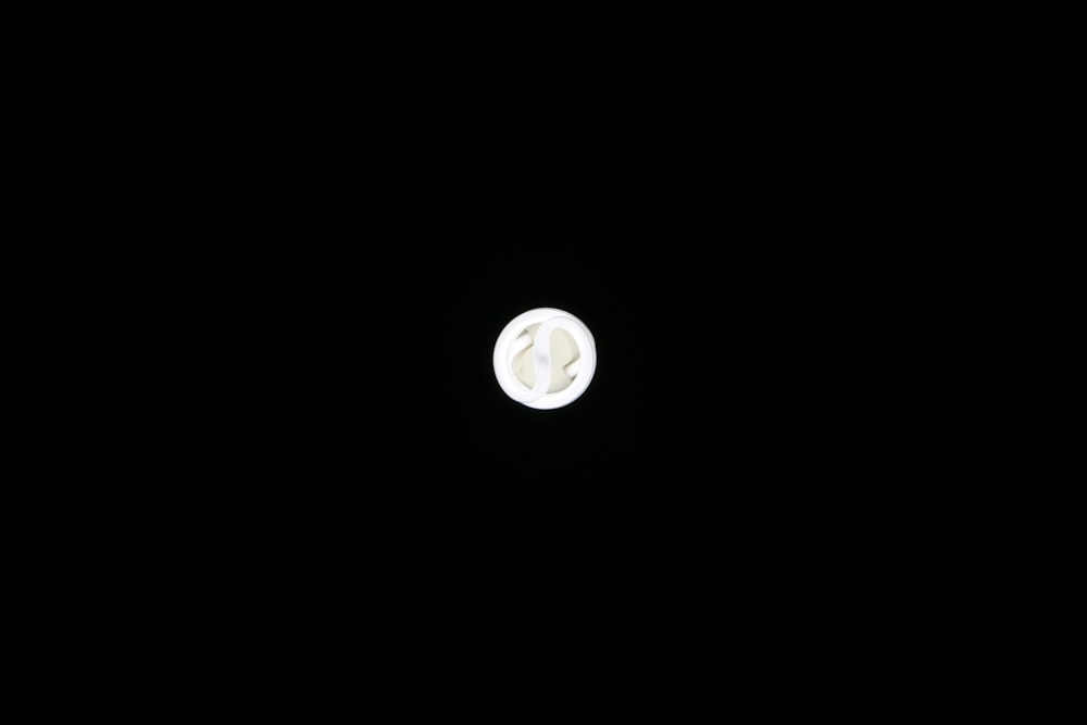 round white ornament on black surface