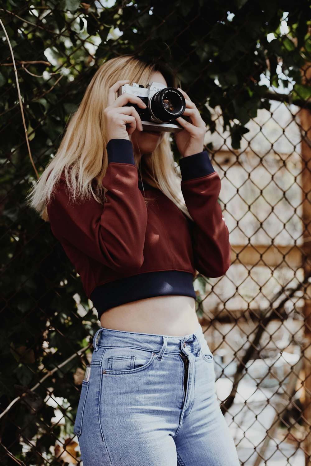 women holding camera taking a picture