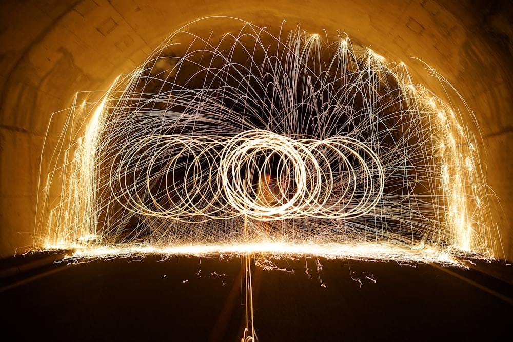 steel wool photography of tunnel at nighttime