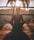 woman doing yoga meditation on brown parquet flooring