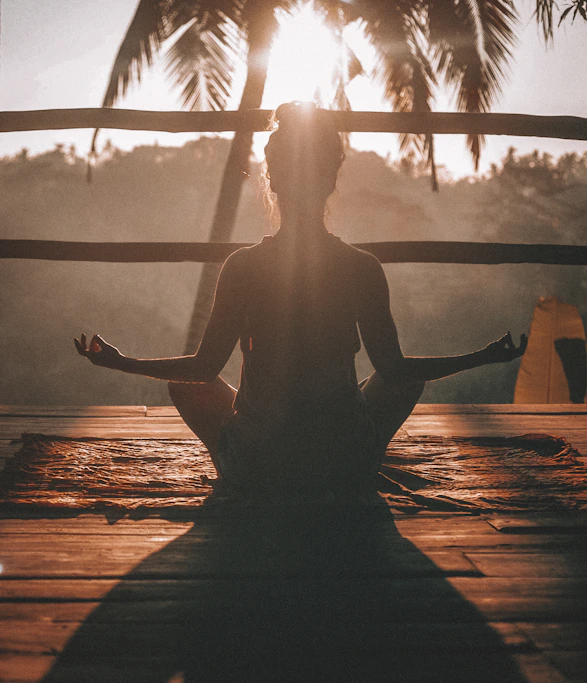 Woman meditating after a Muscle Therapy session
