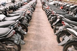 A row of motorcycles lined up neatly outside the 품바론 office in Incheon.