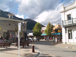 A vibrant street scene in Spartanburg with local shops and people enjoying the day.