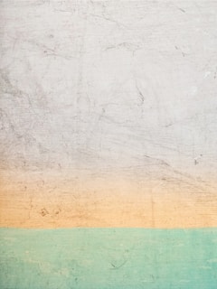 a white and green wall with a blue and yellow stripe
