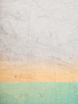 a white and green wall with a blue and yellow stripe