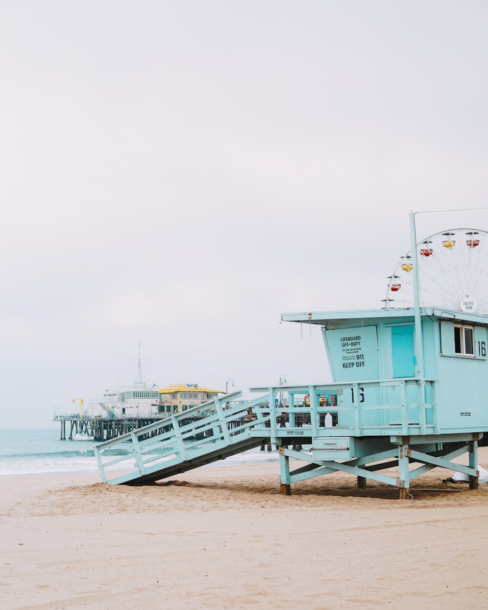 lifeguard post on shore under white sky