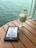 A satisfied customer reading a meditative puzzle book in a serene setting.