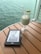 A satisfied customer reading a meditative puzzle book in a serene setting.