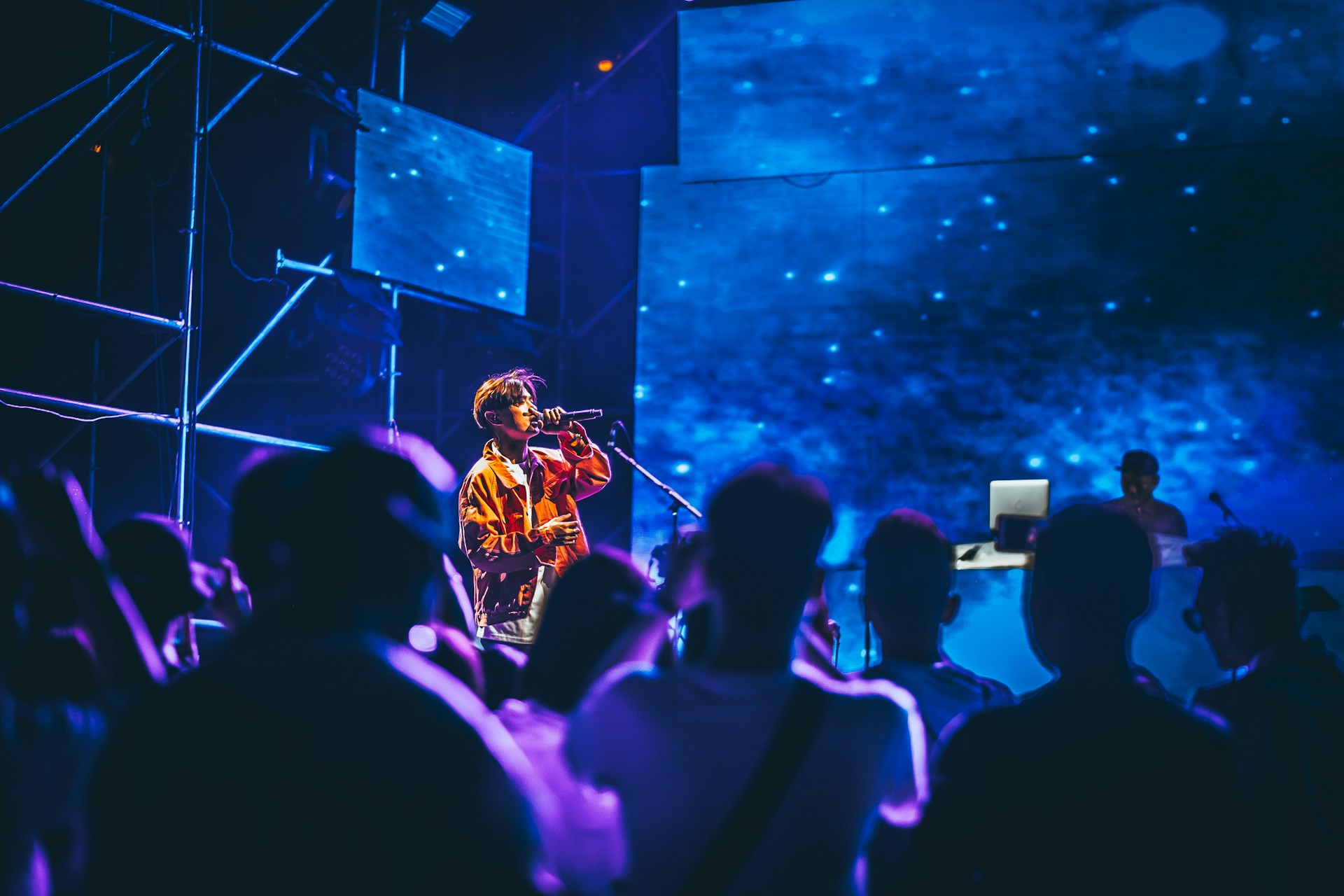 man having concert surrounded with people