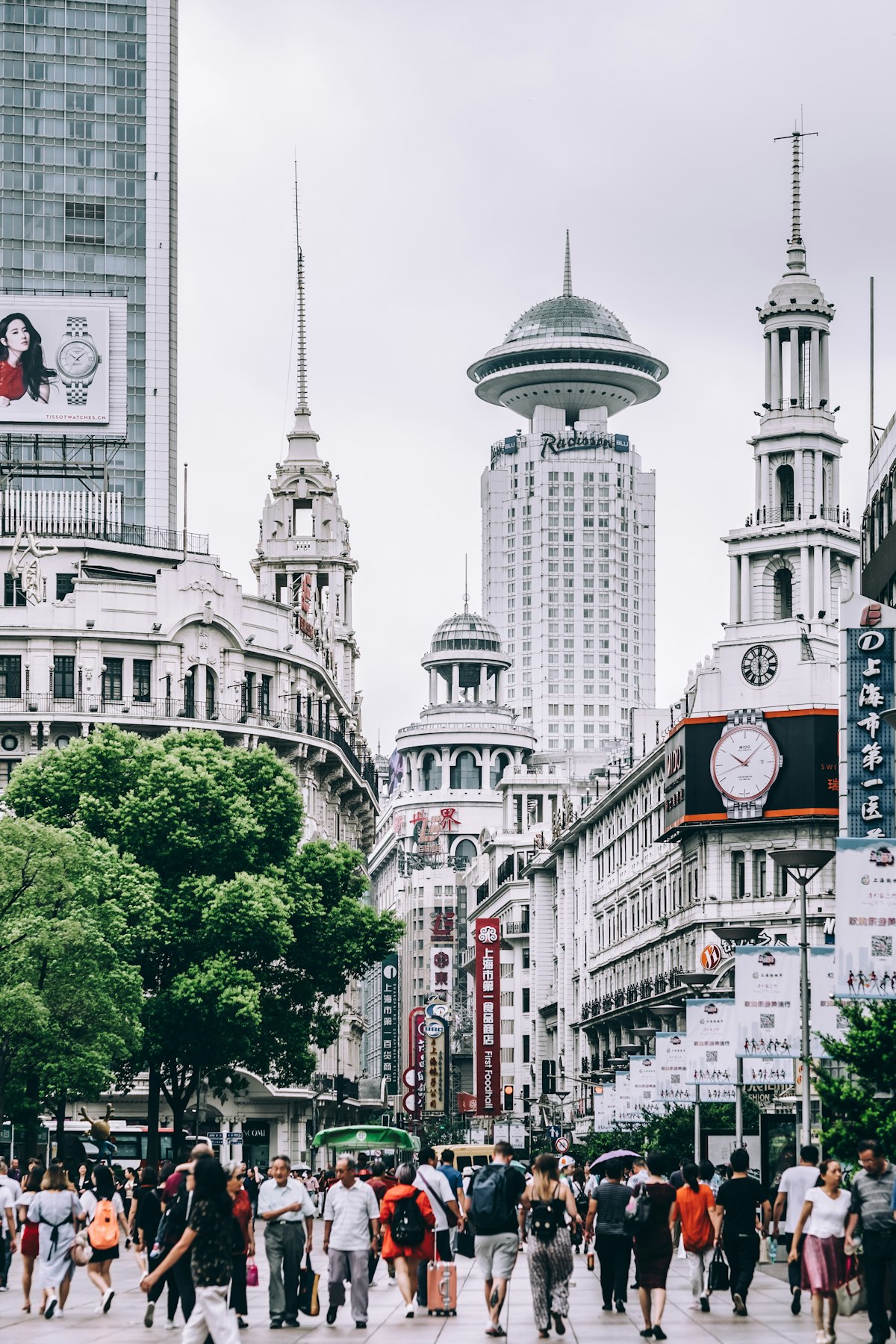 Shanghai Bund colonial buildings facing Pudong skyline across Huangpu