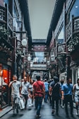 group of people between buildings