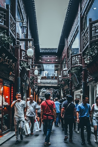 group of people between buildings