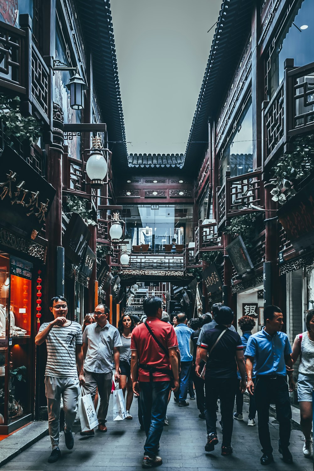 group of people between buildings