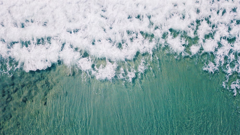 aerial view of waves on beach