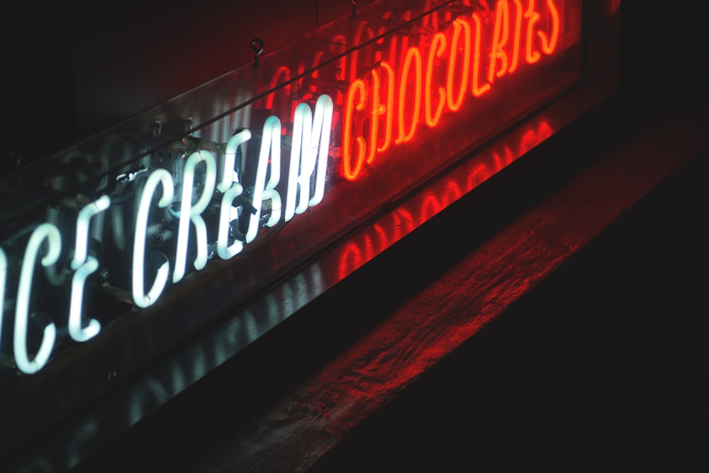 a neon sign that says ice cream parlor