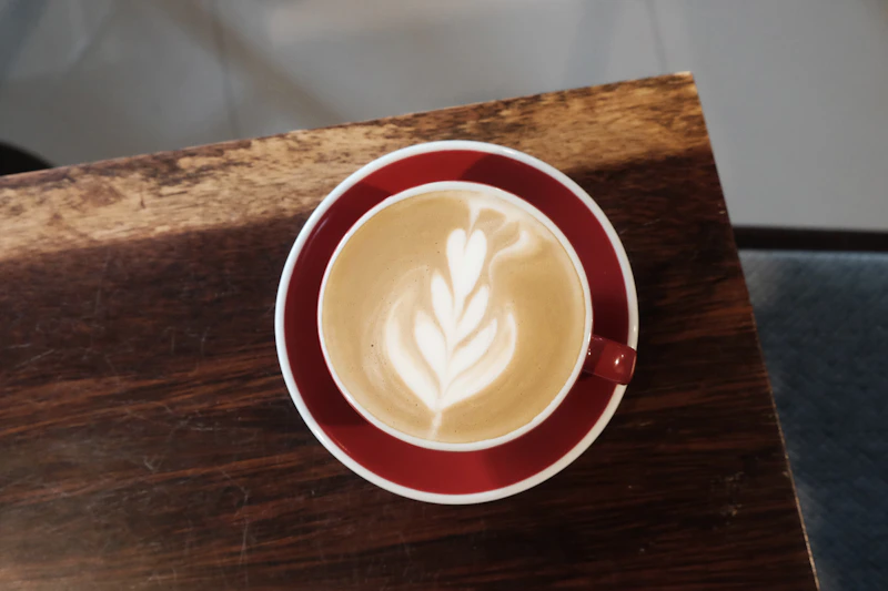 A cappuccino seen from above with latte art