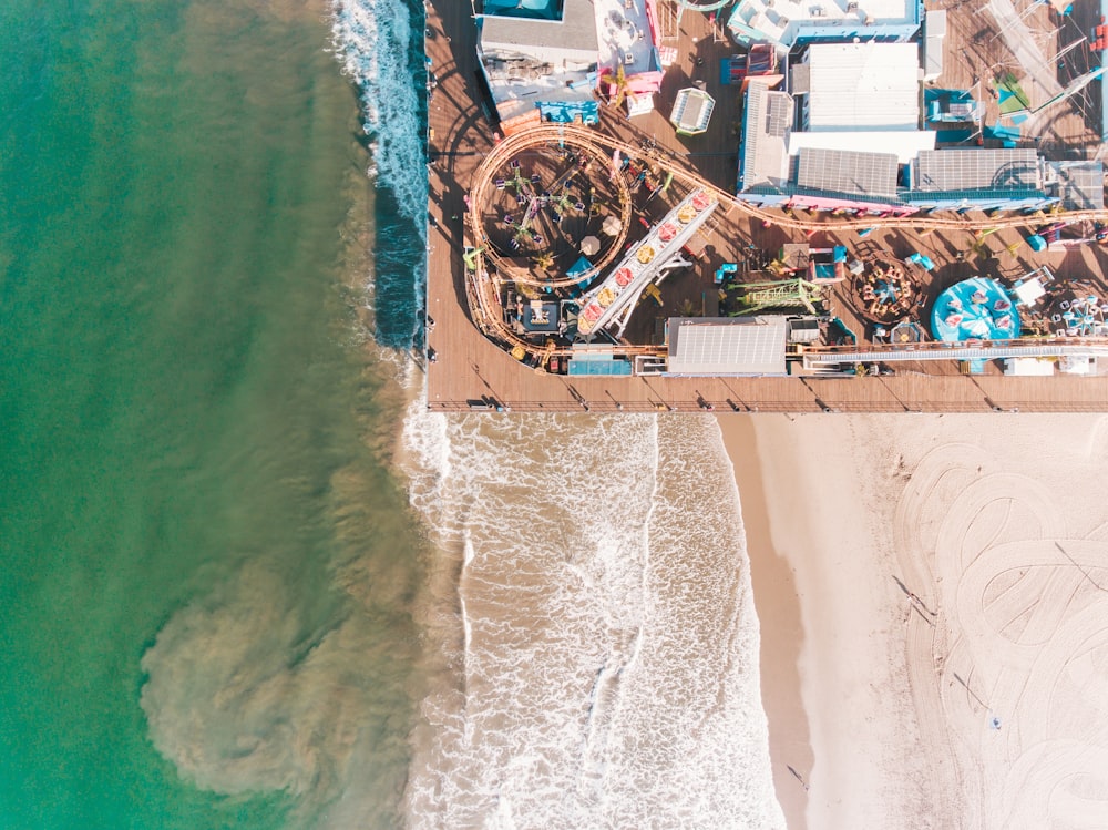 aerial photo of amusement park near bay