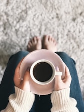 person holding cup of coffee