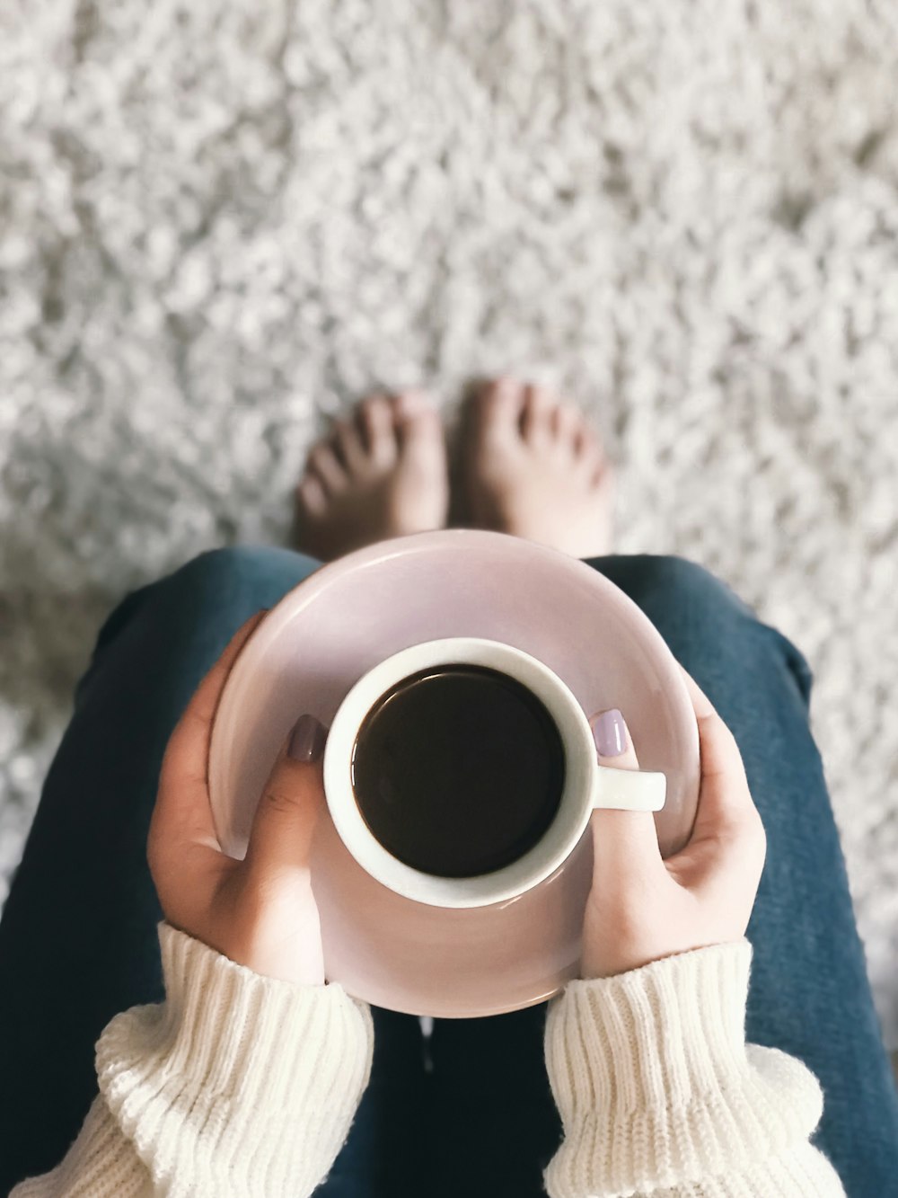 person holding cup of coffee