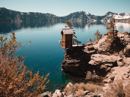wooden house on rock cliff in Crater Lake National Park United States