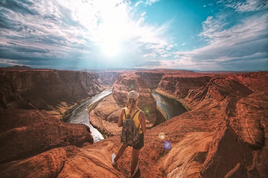 woman standing on top of canyon in Glen Canyon National Recreation Area United States